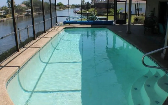 Waterfront vacation home with solar heated pool by Redawning