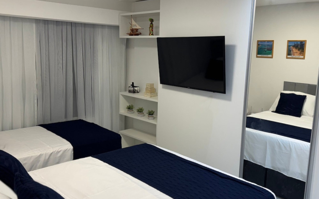 Flat com piscina a 50m da praia