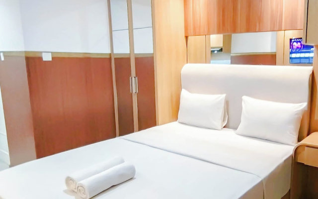 Wooden Touch Studio At Tamansari Skylounge Makassar Apartment