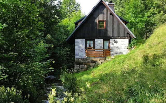 Detached mill by a rippling brook