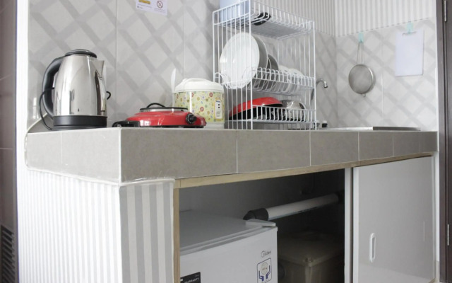Chic and Comfy Studio Room at Mekarwangi Square Apartment Cibaduyut by Travelio