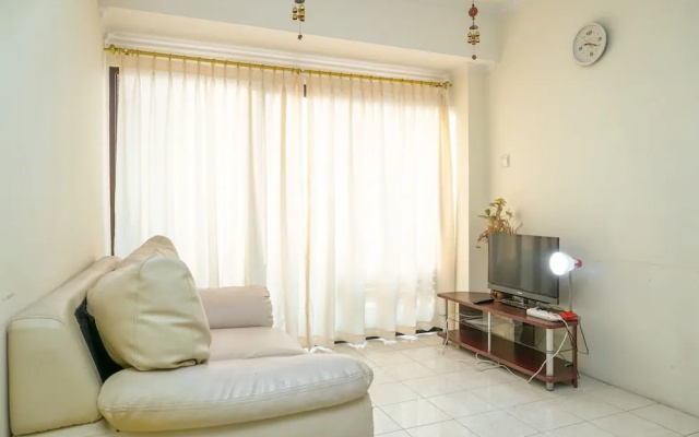 Clean and Homey 1BR at Puri Garden Apartment