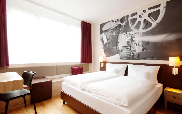 Отель Vienna House Easy München Мюнхен комната для гостей