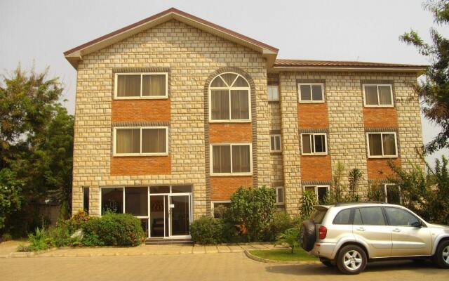 Апартаменты Calabash Green Executive Apartments вид на фасад