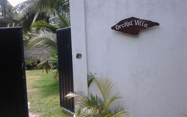 Отель Orchid Villa 10 вид на фасад