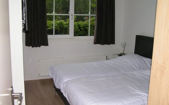Spacious 10-person Villa in Quiet Holiday Park