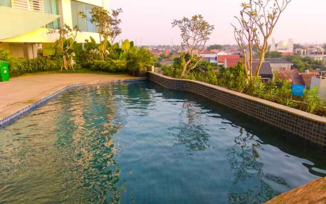Cozy 1BR Apartment at Grand Kamala Lagoon By Travelio