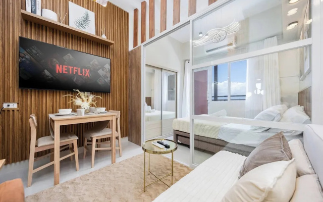 Elegant Wood-accent Studio With Balcony
