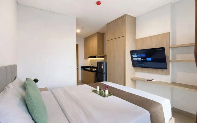 Homey Wooden Touch Studio At Apartment Ciputra World 2