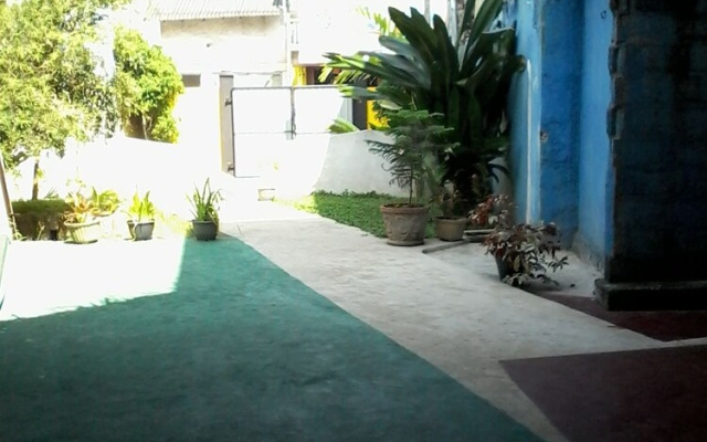Malika's Yellow House