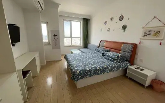 Happy Hour Seaview Apartment (Bayuquan Hongji Branch)