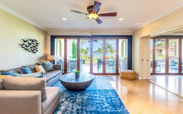 Stylish Split-Level Condo with a Shaded Terrace, Direct Beach Access, and Resort-Style Community Amenities
