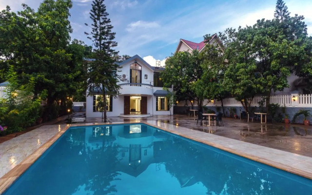 SaffronStays Anugraha - pet-friendly pool villa with garden near Wet N Joy water park