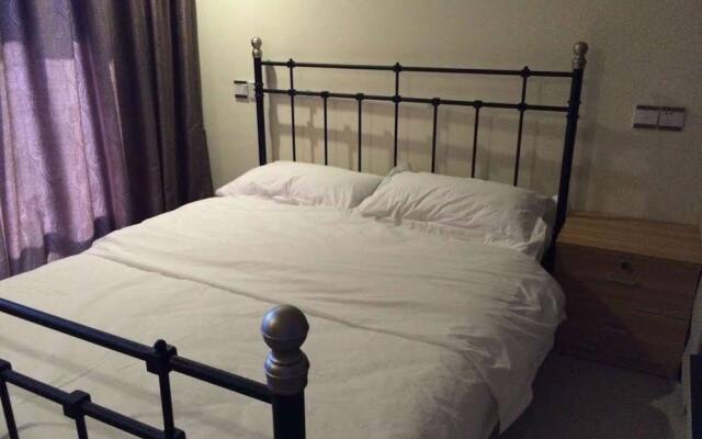 Апартаменты Xingfu Huafu Apartment комната для гостей