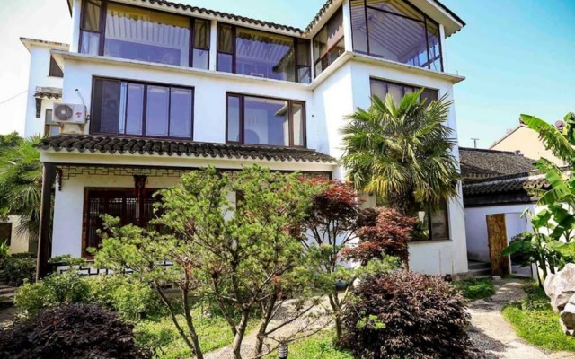 Отель Suzhou Tai Lake Pur-land Inn вид на фасад