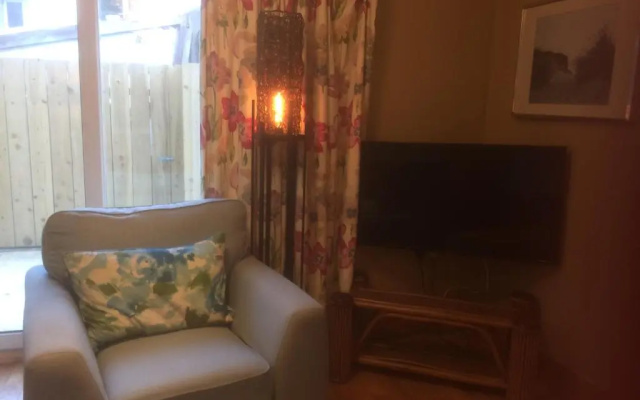 Secluded ground floor village centre apartment
