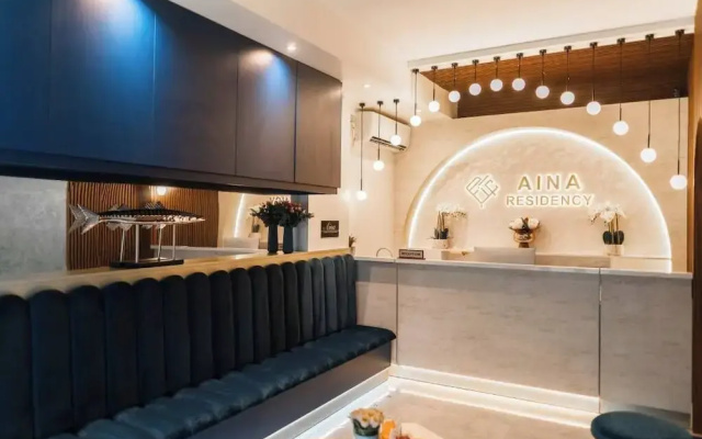 Aina Residency Beachfront Hotel