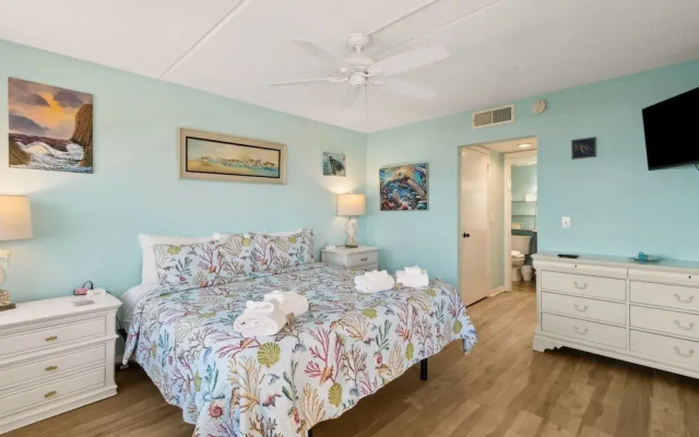 Oceanfront Beach Condo with Private Balcony, Short Walk to Pool and Beach by RedAwning