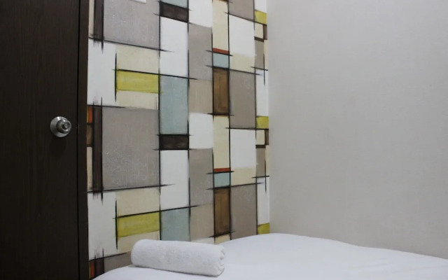 Minimalist 2BR The Suites Metro Apartment By Travelio