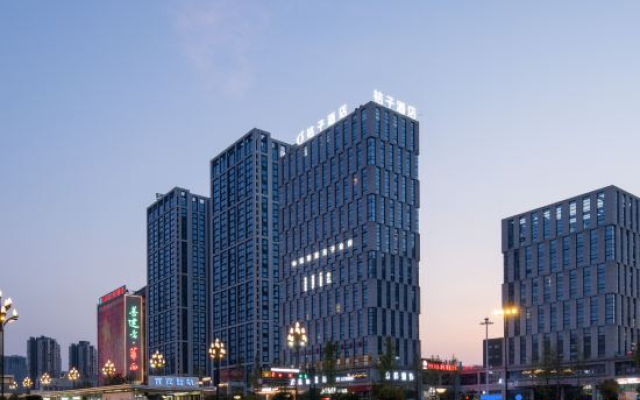 Orange Hotel (Yibin West Railway Station WanXiang World)