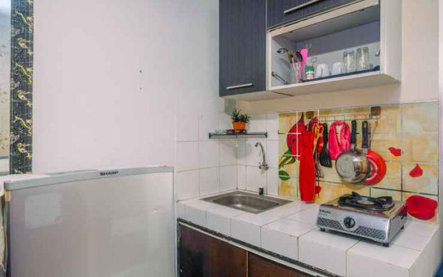 Compact and Homey 2BR Cibubur Village Apartment By Travelio