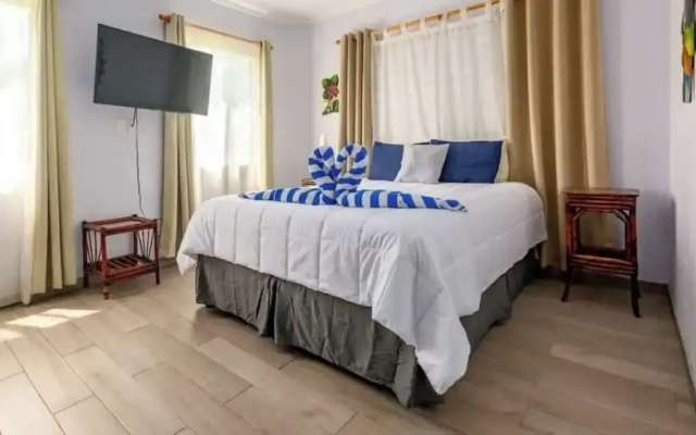 Elegant Condo with Brand-New Fixtures, Shaded Tropical Terrace, and Secluded Beach Access