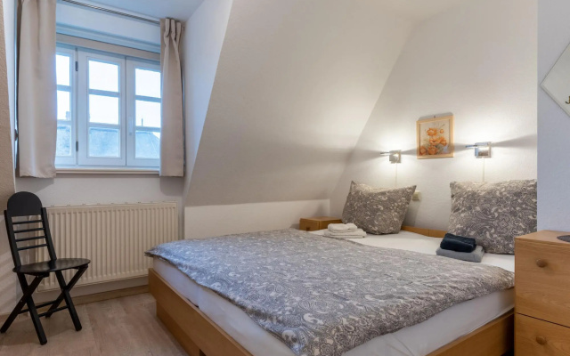 Holiday apartment with a fireplace in a thatched apartment house