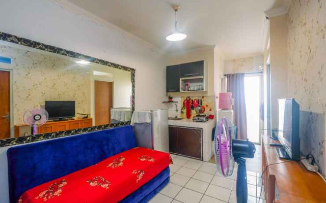 Compact and Homey 2BR Cibubur Village Apartment By Travelio