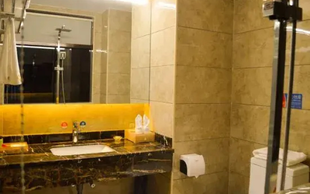 Mangshi Huayou Business Hotel