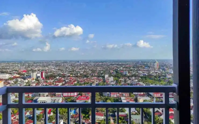 Comfy and Homey 2BR at Vida View Apartment By Travelio