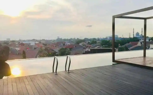 Apartemen Grand Kamala Lagoon Cozy by Lotus Property