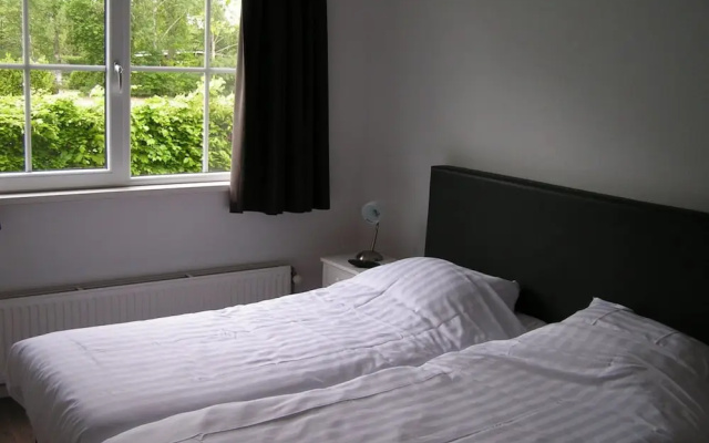 Spacious 10-person Villa in Quiet Holiday Park