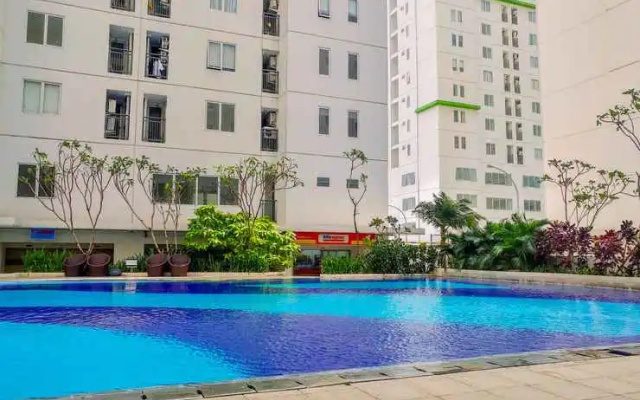 Modern 2BR with City View at Bassura Apartment By Travelio