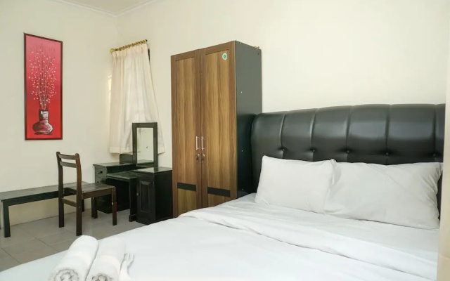 Clean and Homey 1BR at Puri Garden Apartment