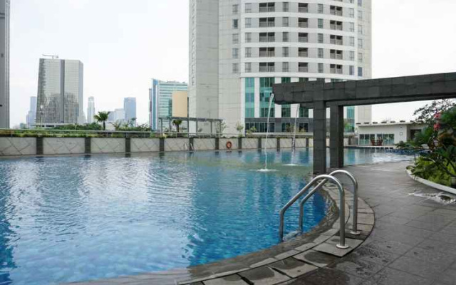 Best Location 2BR Apartment at The Wave Kuningan By Travelio