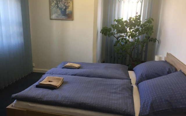 Blue apartment in beautiful English style garden with atmosphere