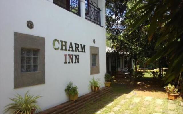 Отель Charm Inn Tourist Rest вид на фасад