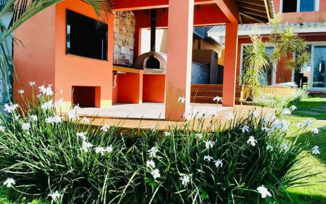 Casa com piscina e ar condicionado em Garopaba
