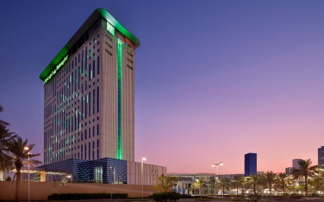 Отель Holiday Inn & Suites Dubai Festival City, an IHG Hotel ОАЭ, Дубай - отзывы, цены и фото номеров - забронировать отель Holiday Inn & Suites Dubai Festival City, an IHG Hotel онлайн вид на фасад