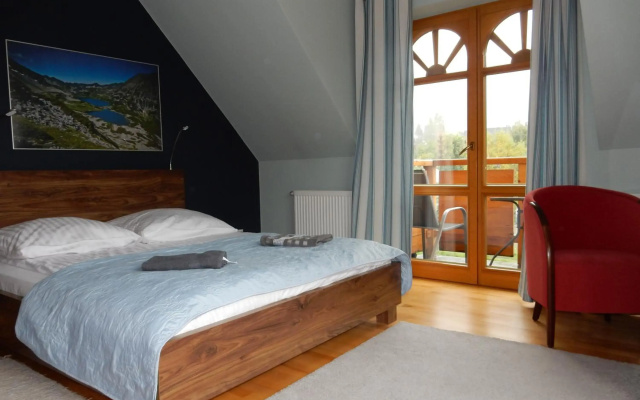 Domek za Strugiem - pokoje i apartamenty