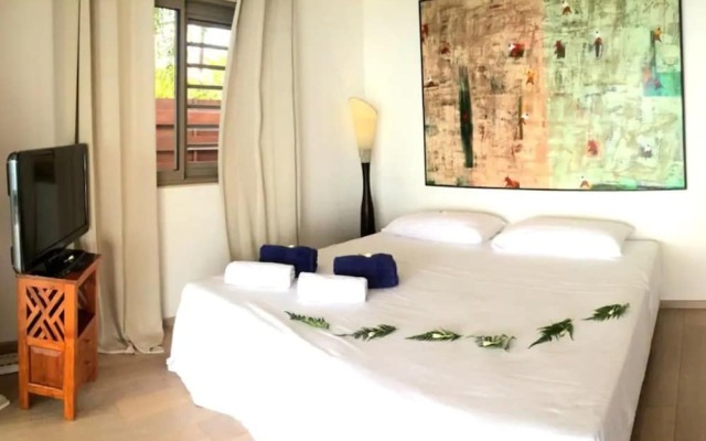 Отель Villa Vahineria 9pax Французская Полинезия, Пунаауиа - отзывы, цены и фото номеров - забронировать отель Villa Vahineria 9pax онлайн комната для гостей