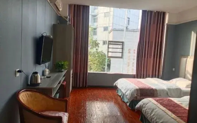 Defu Business Hotel (Yilong Xinzhengzhen Branch)