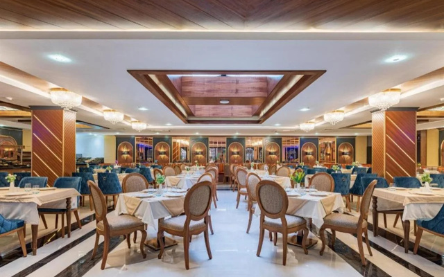 Отель Elysium Green Suites