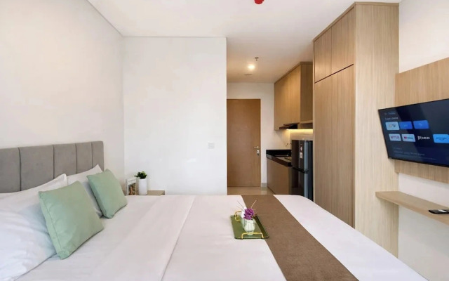 Homey Wooden Touch Studio At Apartment Ciputra World 2