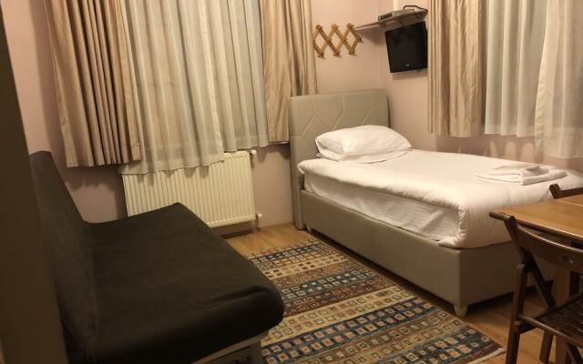 Апартаменты Topkapi Apartments Стамбул комната для гостей