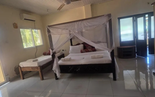 Luxurious 4-bedroom Holiday House With Pool Access in Diani Beach