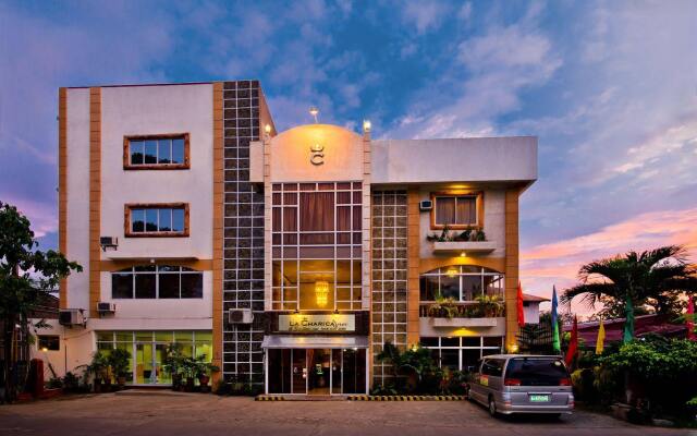 Отель La Charica Inn & Suites Филиппины, Пуэрто-Принцеса - отзывы, цены и фото номеров - забронировать отель La Charica Inn & Suites онлайн вид на фасад