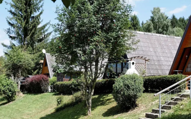 Wooden Chalet With Terrace Near a Swimming Lake