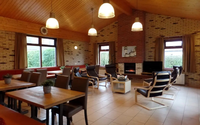 Tidy House with Fireplace near North Sea Beach