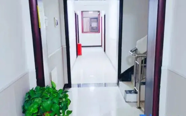 Zhoukou Kaixinyuan Hotel (Baicheng Railway Station)